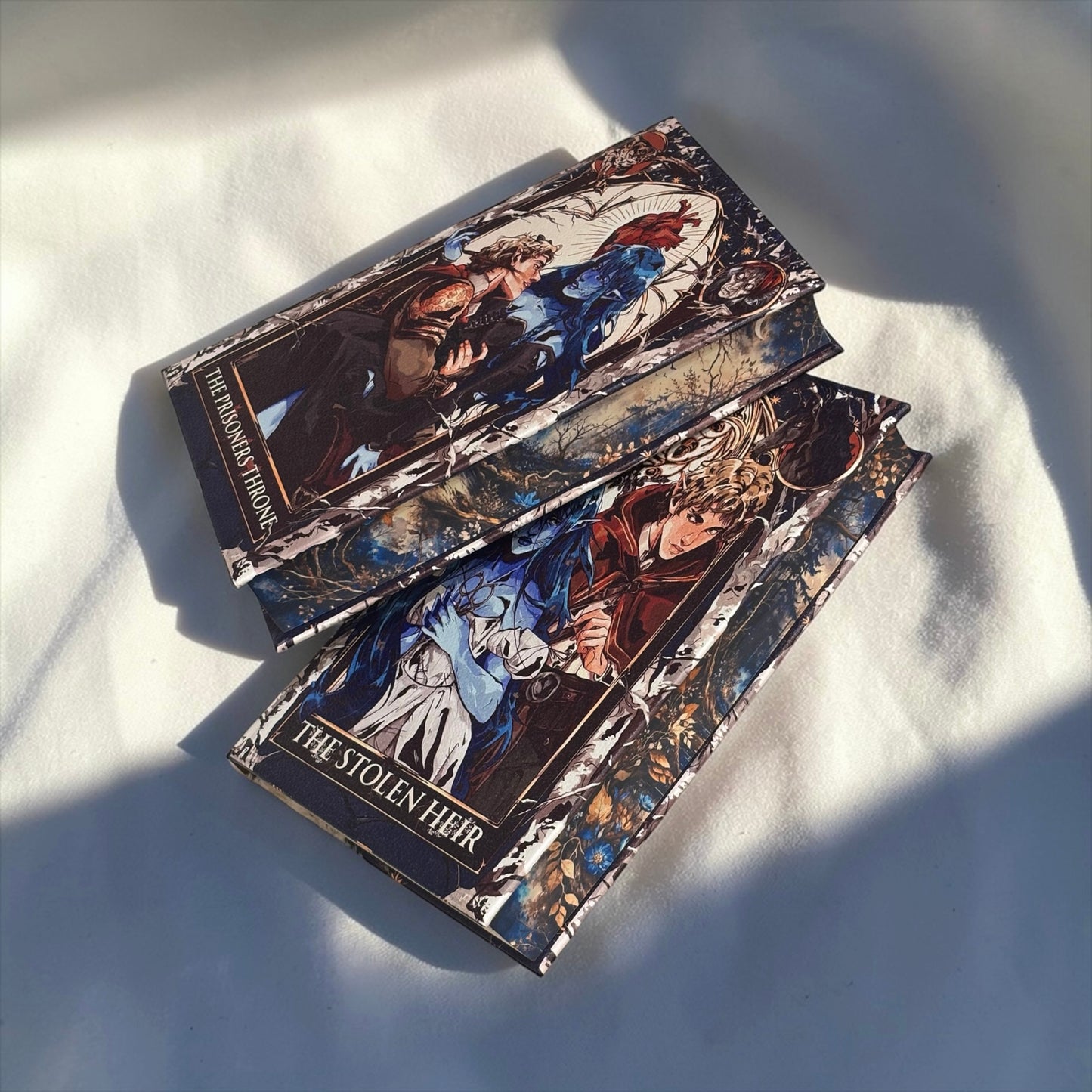 PREORDER - The Stolen Heir Duology Luxury Rebinds X Marine VHS Hand-bound Faux Leather Hardback | Sprayed Edges | Custom End Papers